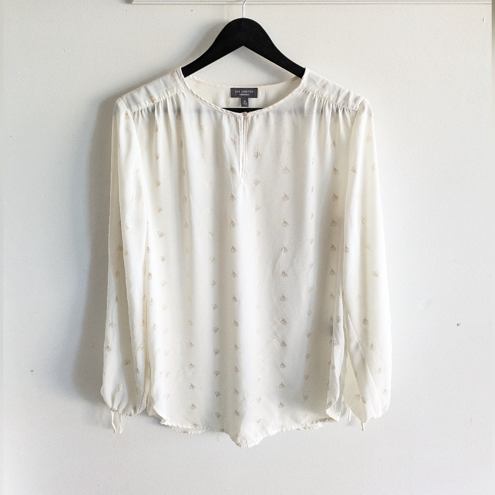 The limited white and gold floral long sleeve keyhole blouse size M